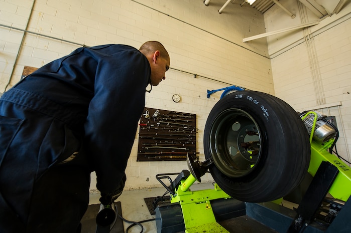 Staff Sgt. Bryan Zitnick, 628th Logistics Readiness Squadron vehicle maintenance technician, separates a tire from its rim during a tire change Sept. 6, 2012, at Joint Base Charleston – Air Base, S.C. Vehicle maintenance technicians maintain JB Charleston's entire vehicle fleet, keeping cars, trucks and buses operating smoothly.  (U.S. Air Force photo/Airman 1st Class George Goslin)