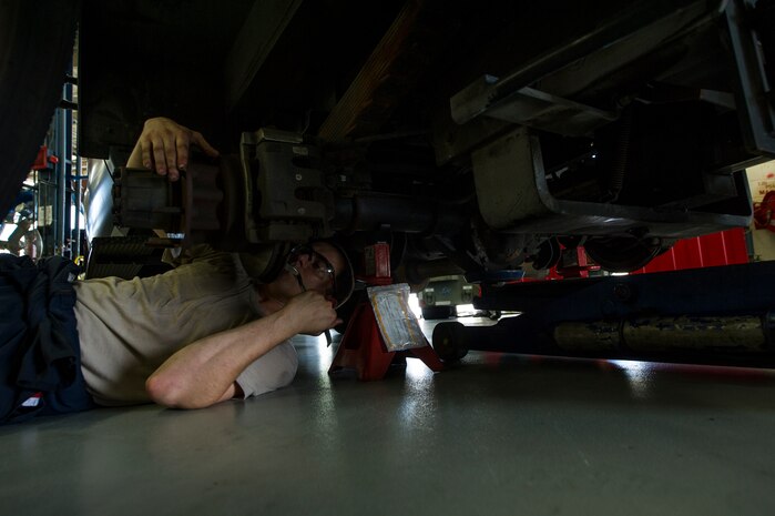 Senior Airman Benjamin Kingston, 628th Logistics Readiness Squadron vehicle maintenance technician, adjusts the parking brake on a vehicle during routine vehicle maintenance Sept. 6, 2012, at Joint Base Charleston - Air Base, S.C. Vehicle maintenance technicians maintain JB Charleston's entire vehicle fleet keeping cars, trucks and buses operating smoothly.  (U.S. Air Force photo/Airman 1st Class George Goslin)