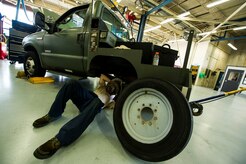 Senior Airman Benjamin Kingston, 628th Logistics Readiness Squadron vehicle maintenance technician, adjusts the parking brake on a vehicle during routine vehicle maintenance Sept. 6, 2012, at Joint Base Charleston - Air Base, S.C. Vehicle maintenance technicians maintain JB Charleston's entire vehicle fleet, keeping cars, trucks and buses operating smoothly. (U.S. Air Force photo/Airman 1st Class George Goslin)