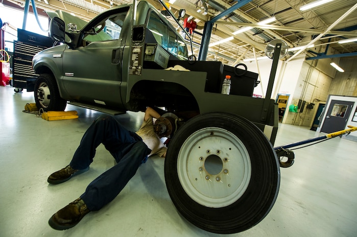 Senior Airman Benjamin Kingston, 628th Logistics Readiness Squadron vehicle maintenance technician, adjusts the parking brake on a vehicle during routine vehicle maintenance Sept. 6, 2012, at Joint Base Charleston - Air Base, S.C. Vehicle maintenance technicians maintain JB Charleston's entire vehicle fleet, keeping cars, trucks and buses operating smoothly. (U.S. Air Force photo/Airman 1st Class George Goslin)