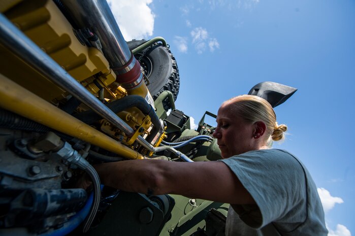 Senior Airman Tammy Walbolt, 628th Logistics Readiness Squadron vehicle maintenance technician, replaces a starter on a vehicle Sept. 6, 2012, at Joint Base Charleston - Air Base, S.C. Vehicle maintenance technicians maintain JB Charleston's entire vehicle fleet, keeping cars, trucks and buses operating smoothly. (U.S. Air Force photo/Airman 1st Class George Goslin)