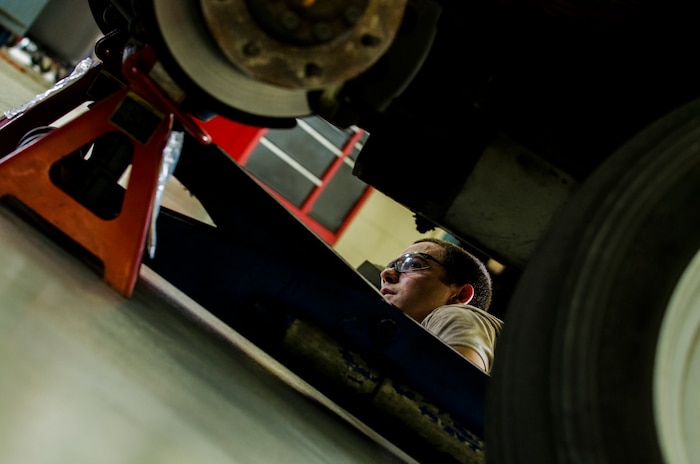 Senior Airman Benjamin Kingston, 628th Logistics Readiness Squadron vehicle maintenance technician, checks a vehicle’s brake system during a routine inspection Sept. 6, 2012, at Joint Base Charleston - Air Base, S.C. Vehicle maintenance technicians maintain JB Charleston's entire vehicle fleet, keeping cars, trucks and buses operating smoothly. (U.S. Air Force photo/Airman 1st Class George Goslin)