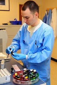 Staff Sergeant Kenneth Frati, 628th Medical Group, medical laboratory Technician, changes reagents, at the 628th MDG laboratory at Joint Base Charleston - Air Base, S.C., Sept. 11, 2012. The 628th MDG Laboratory conducts all clinical laboratory procedures required in support of the 628th MDG’s mission. (U.S. Air Force photo/ Airman 1st Class Chacarra Walker)