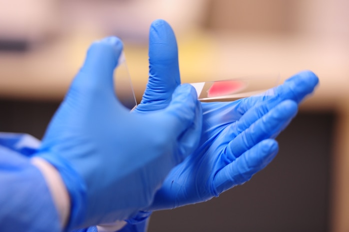 Staff Sergeant Kenneth Frati, 628th Medical Group medical laboratory technician, makes blood smears on microscope slides, at the 628th MDG laboratory Sept. 11, 2012 at Joint Base Charleston - Air Base, S.C. The 628th MDG Laboratory conducts all clinical laboratory procedures required in support of the 628th MDG’s mission. (U.S. Air Force photo/Airman 1st Class Chacarra Walker)