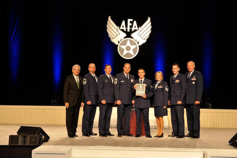 148th Fighter Wing members accept the Air Force Association's 2012 Outstanding Air National Guard Flying Unit Award at the 2012 Air and Space Conference in National Harbor, MD.  Pictured are Air Force Association Chairman of the Board, S. Sandford Schlitt, Sr. Master Sgt. Matt Wolff, Col. Frank Stokes, Chief Master Sgt. Mark Rukavina, Airman First Class Peter Erdahl, Master Sgt. Cynthia Wahl, Lt. Will Carr and Director of the Air National Guard, Lt. Gen. Harry "Bud" Wyatt.  (Courtesy Photo)