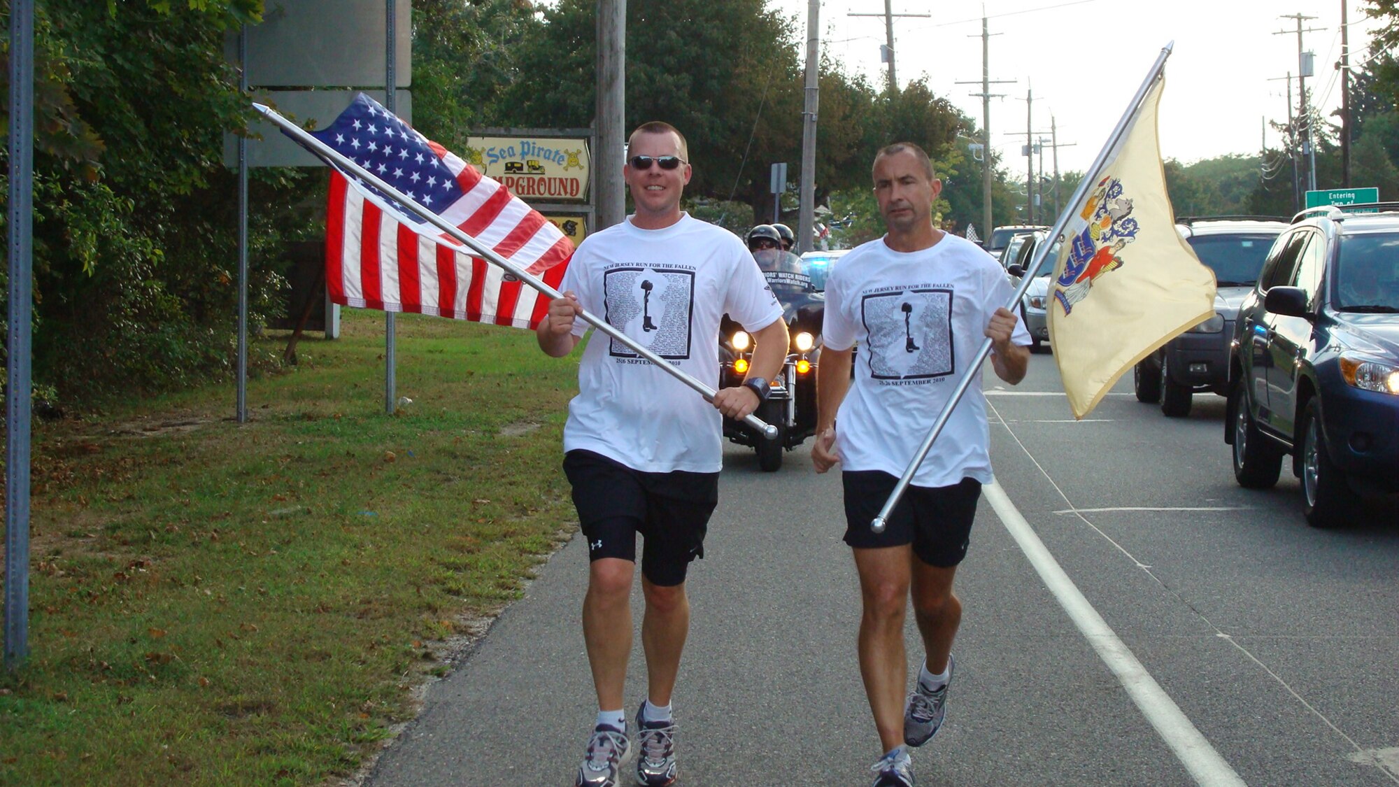 Maj. Brian Mix, who is currently assigned to Headquarters Air Mobility Command, and Chief Master Sgt. Roger Ball, who is now retired, run the 140-mile New Jersey Run for the Fallen Sept. 25, 2010, while they were both stationed at Joint Base McGuire-Dix-Lakehurst, N.J. Run for the Fallen, currently held in New Jersey, Arkansas and California honor Gold Star family and friends. (Courtesy photo)