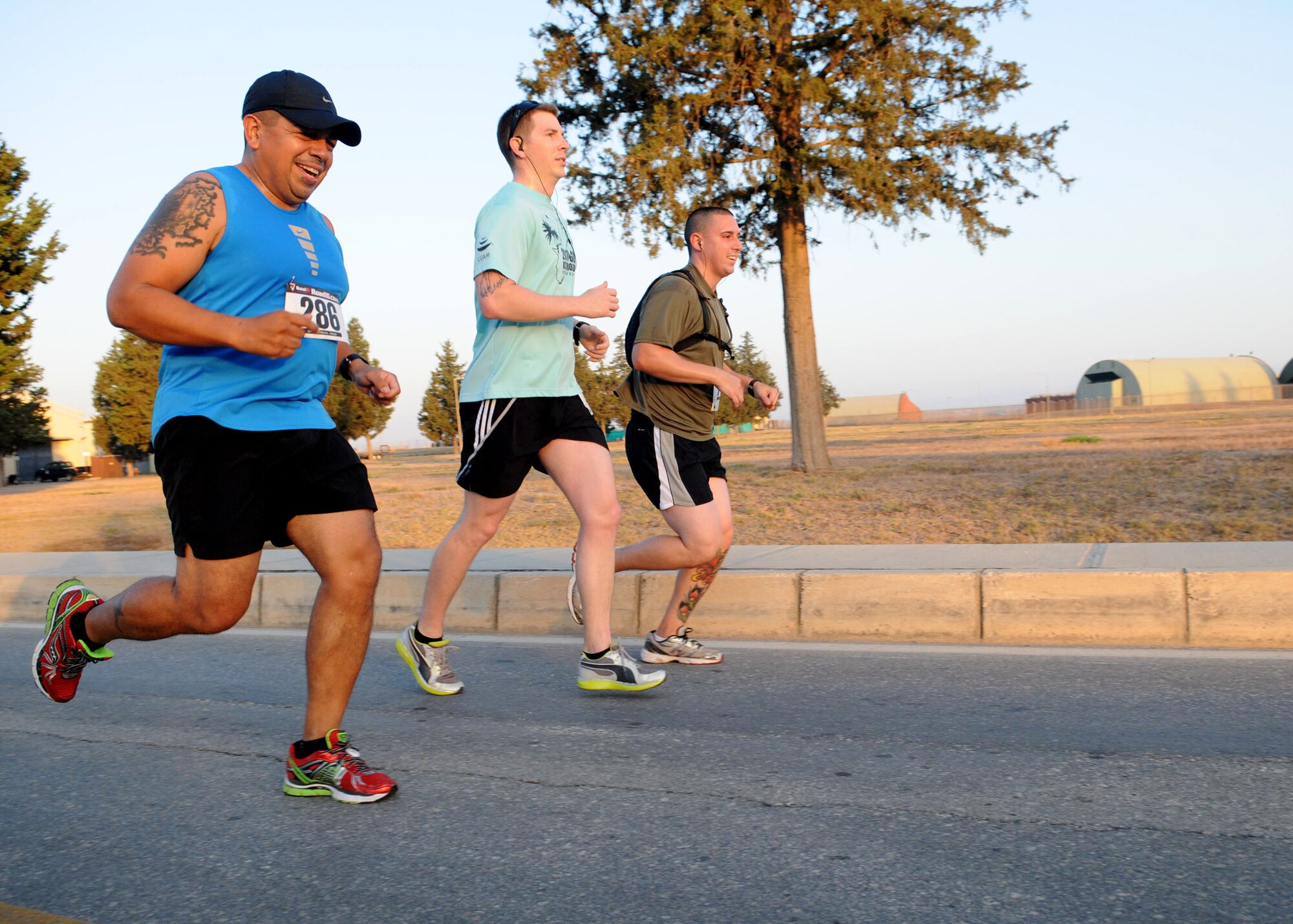 Members of the 39th Security Forces Squadron share a laugh as they participate in the Incirlik Half Marathon Sept. 15, 2012, at Incirlik Air Base, Turkey. More than 80 people participated in the event, which coincided with the Air Force Marathon held at Wright-Patterson Air Force Base, Ohio. (U.S. Air Force photo by Senior Airman MarissaTucker/Released) 

