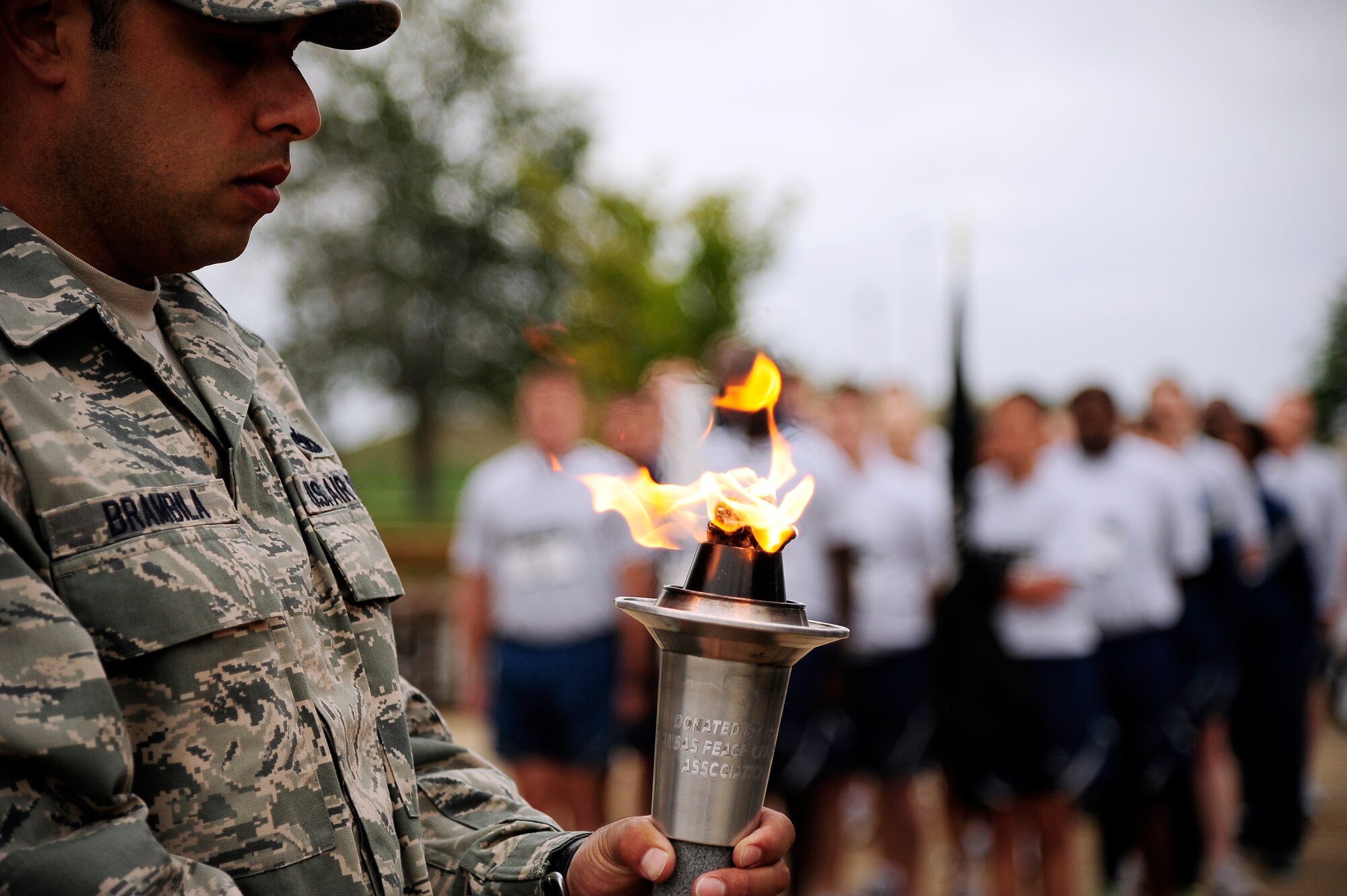 Tech. Sgt. Eric Brambila, 509th Maintenance Squadron, lights the torch during a ceremony to start the prisoner of war and missing-in-action run at Whiteman Air Force Base, Mo., Sept. 13. The annual POW/MIA run lasts 24-hours and is done annually to show respect to service members who have sacrificed themselves in the sake of their country and the family member they leave behind. (U.S. Air Force photo/ Senior Airman Cody H. Ramirez)