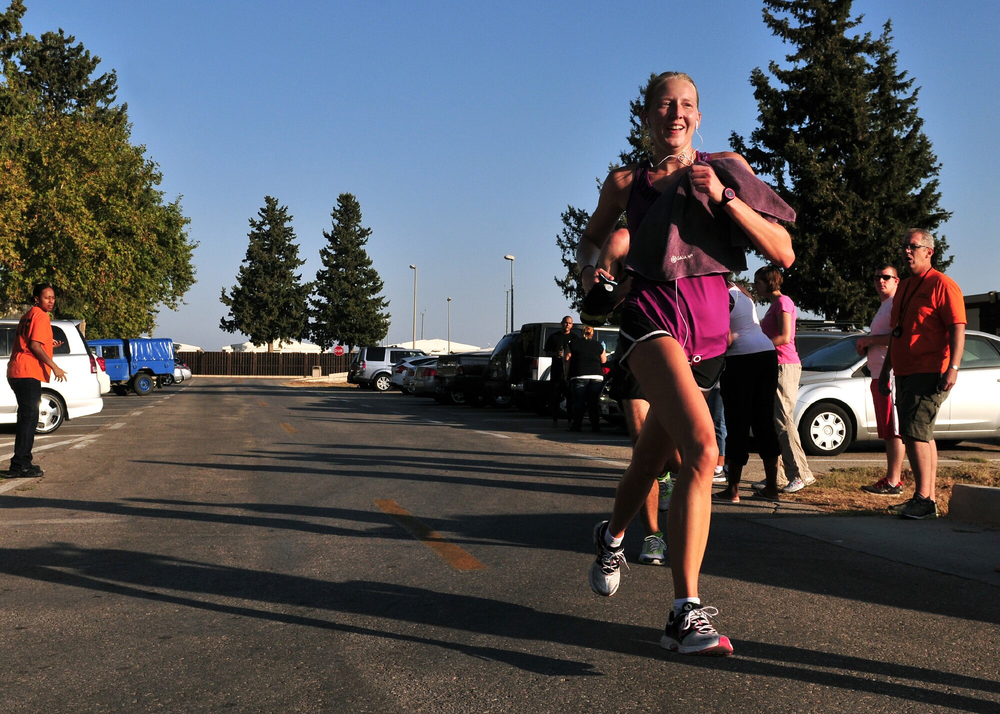 Capt. Kimberly Caldwell, 39th Medical Operations Squadron, crosses the finish line of the Incirlik half marathon at Arkadas Park with a time of 1 hour 44 minutes and 8 seconds as the first place female finisher Sept. 15, 2012, at Incirlik Air Base, Turkey. More than 80 Team Incirlik members ran in the half marathon. (U.S. Air Force photo by Senior Airman Daniel Phelps/Released)