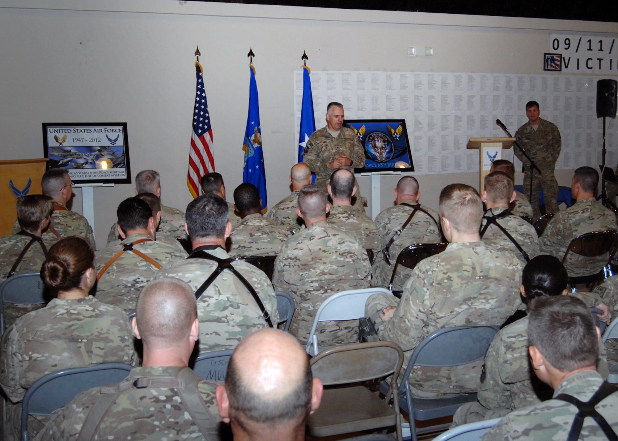 Brig. Gen. Scott Dennis, Kandahar Airfield and 451st Air Expeditionary Wing, commander, addresses the crowd during observance of the 65th Anniversary of the Air Force becoming its own branch of the military here Sept. 18. (U.S. Air Force photo/Master Sgt. Russell Martin/RELEASED)