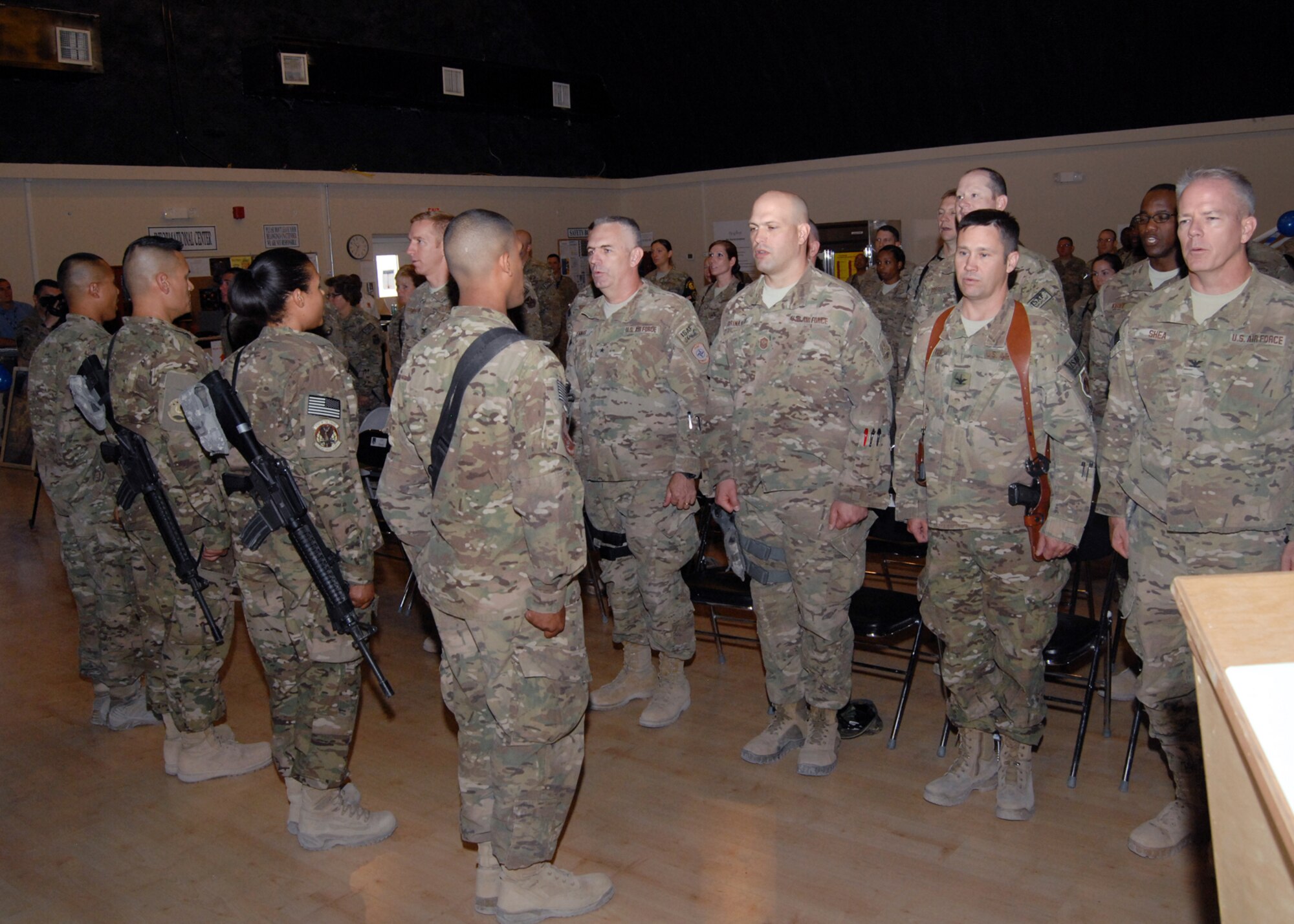 Representatives of the First Four Airmen’s Council, 5/6 noncommissioned officer council, Top 3 senior NCO council and company grade officers council lead the audience in reciting the Airman’s Creed during commemoration of the 65th Anniversary of the Air Force becoming a separate service component here Sept. 18. (U.S. Air Force photo/Master Sgt. Russell Martin/RELEASED)