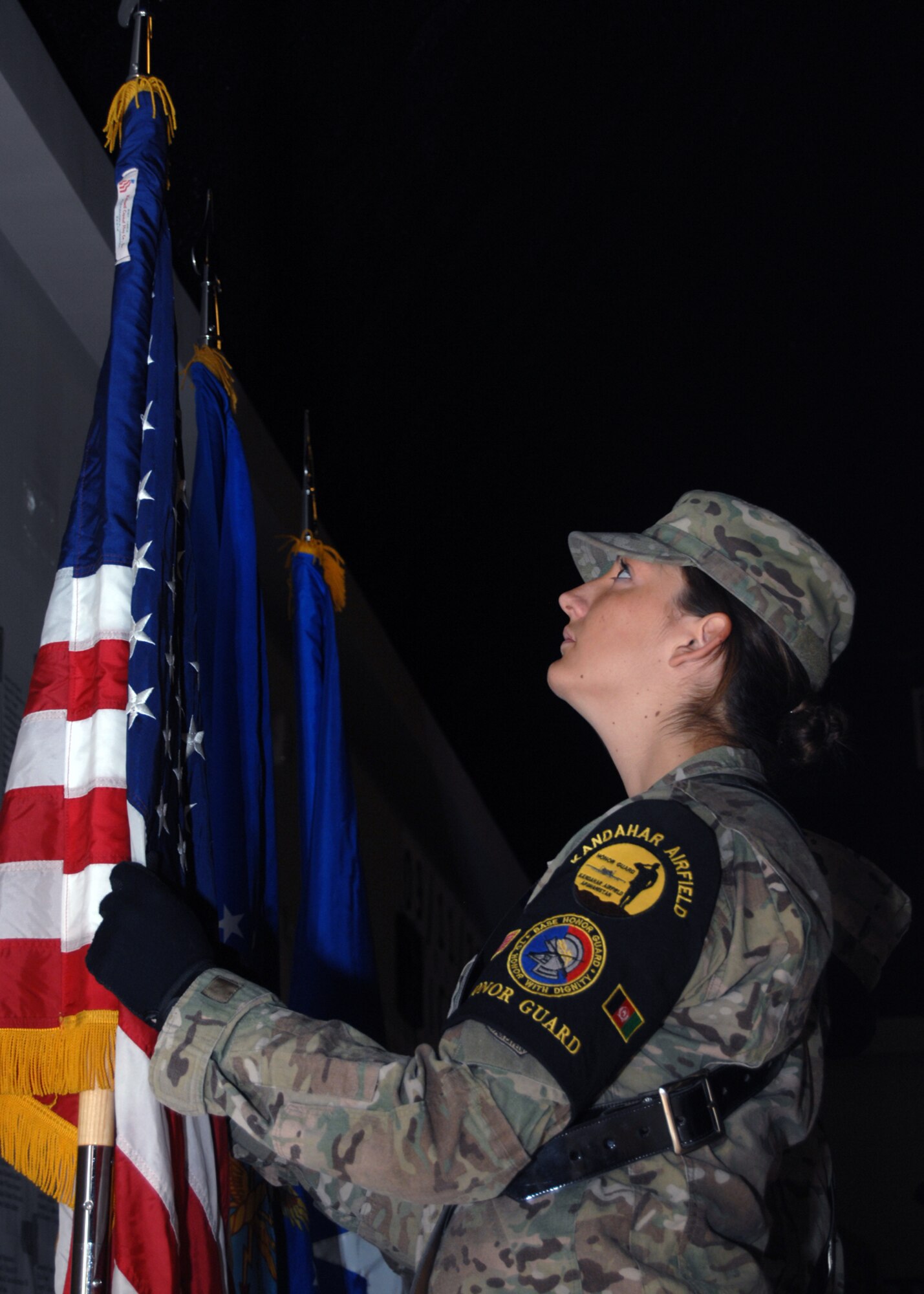 Senior Airman Alaina Deines, 451st Expeditionary Maintenance Squadron, posts the colors at the start of the 65th Anniversary of the Air Force celebration here Sept. 18. (U.S. Air Force photo/Master Sgt. Russell Martin/RELEASED)