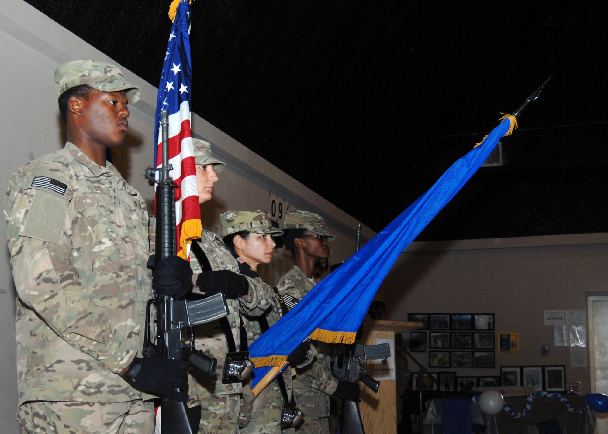 From left, Airman 1st Class Byron Hogans, 451st Expeditionary Maintenance Squadron; Senior Airman Alaina Deines, 451st EMXS; Senior Master Sgt. Abigail Rivera, 651 Expeditionary Aeromedical Evacuation Squadron; and Senior Airman Precious Roy, 451st Expeditionary Security Forces Squadron present the colors during the playing of the National Anthem at the 451st Air Expeditionary Wing’s recognition of the Air Force’s 65th Anniversary here Sept. 18. (U.S. Air Force photo/Master Sgt. Russell Martin/RELEASED)