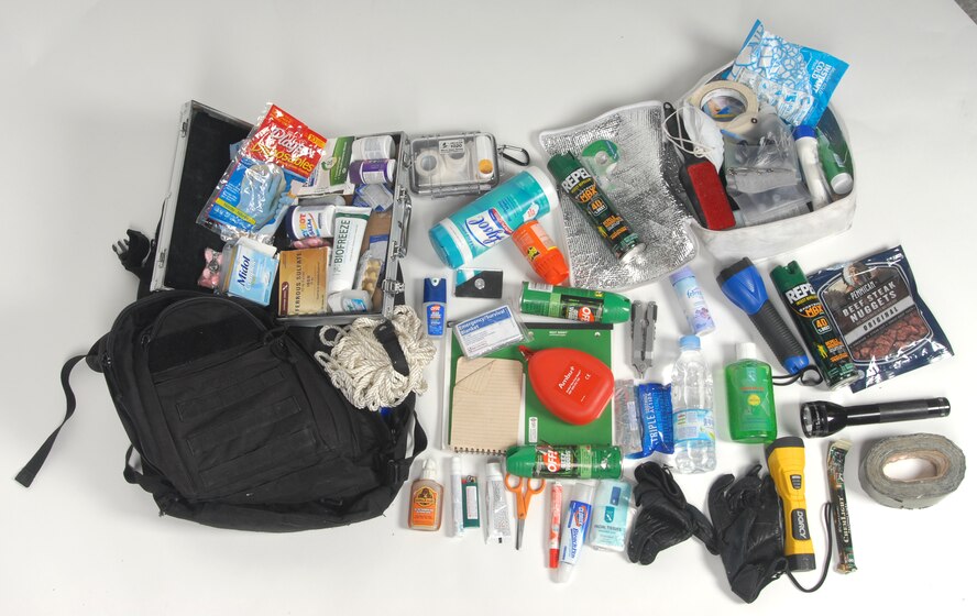The supplies from Senior Airman Charles Sothikhoun’s backpack are displayed at Kunsan Air Base, Republic of Korea, Sept. 13, 2012. His most-requested items are water and bugspray, but he also carries a wealth of other items to be ready for most situations. (U.S. Air Force photo/Staff Sgt. Jonathan Fowler)