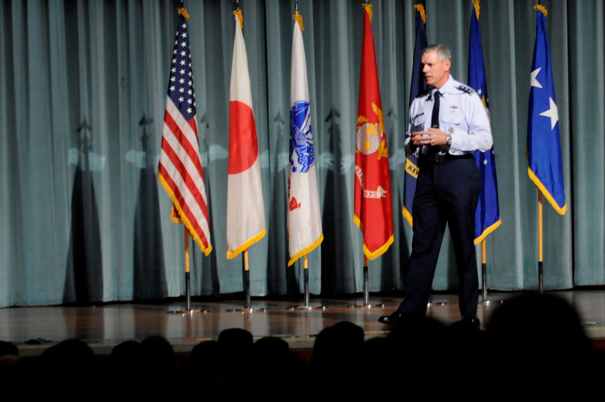U.S. Air Force Lt. Gen. Sam Angelella, U.S. Forces Japan and 5th Air Force commander, speaks to Airmen during an all-call at the Keystone Theater on Kadena Air Base, Japan, Sept. 19, 2012. The general shared regional current events and addressed concerns from Kadena. (U.S. Air Force photo/Airman 1st Class Tara A. Williamson)