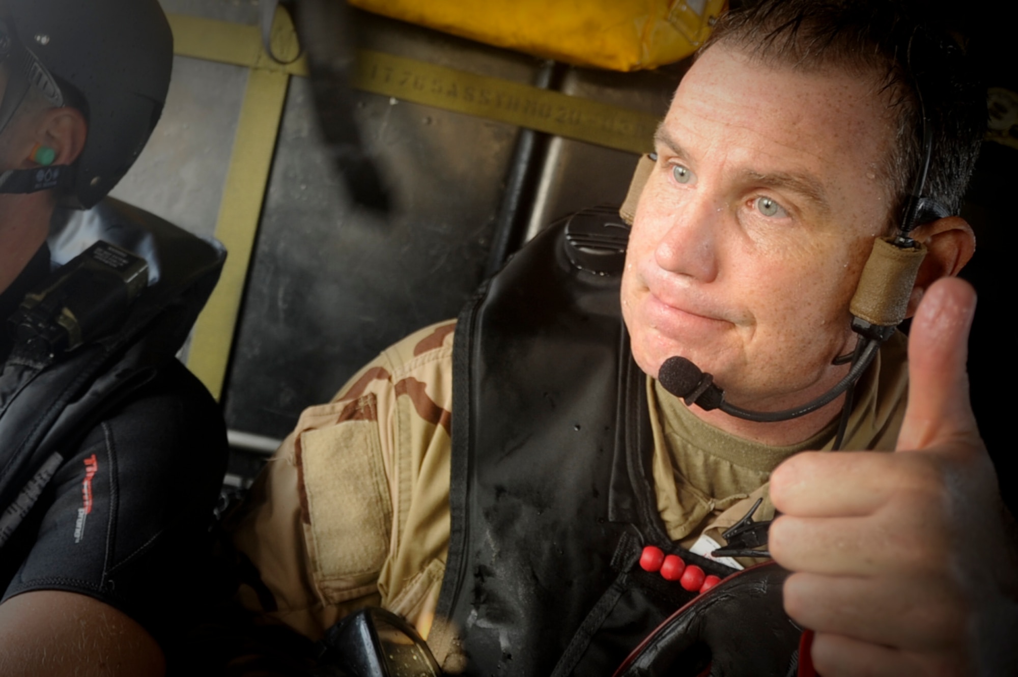 U.S. Air Force Lt. Col. Glen Frazier, 31st Rescue Squadron commander, gives the thumbs up gesture during a training exercise with the 33rd Rescue Squadron on Okinawa, Japan, Sept. 18, 2012. The two Rescue Squadrons work together in order to train for their mission of rescuing U.S. and allied military members. (U.S. Air Force photo/Airman 1st Class Brooke P. Beers)