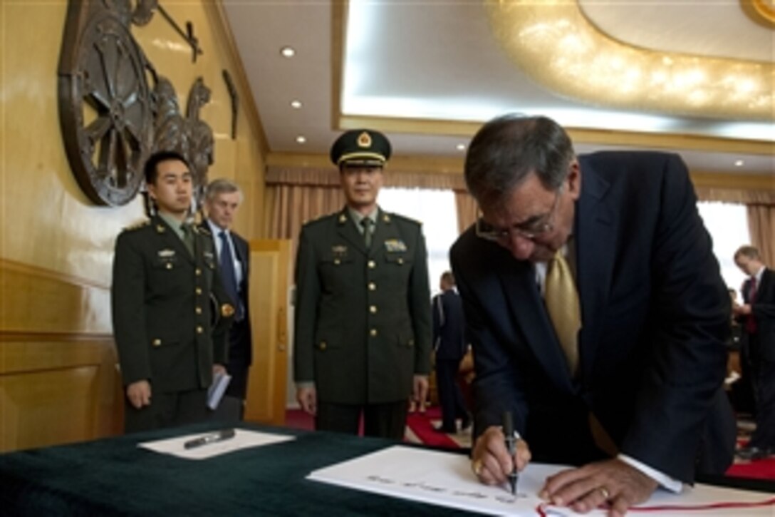 Secretary of Defense Leon E. Panetta signs the guest book after a meeting with Commander of the People's Liberation Army Armored Forces Academy Maj. Gen. Zu Hang in Beijing, China, on Sept. 19, 2012.  Panetta also met with Chinese Vice President Xi Jinping and his defense counterparts to discuss regional security issues of interest to both nations.  Panetta visited Tokyo, Japan, before continuing to Beijing and will travel to Auckland, New Zealand, on a weeklong trip to the Pacific.  