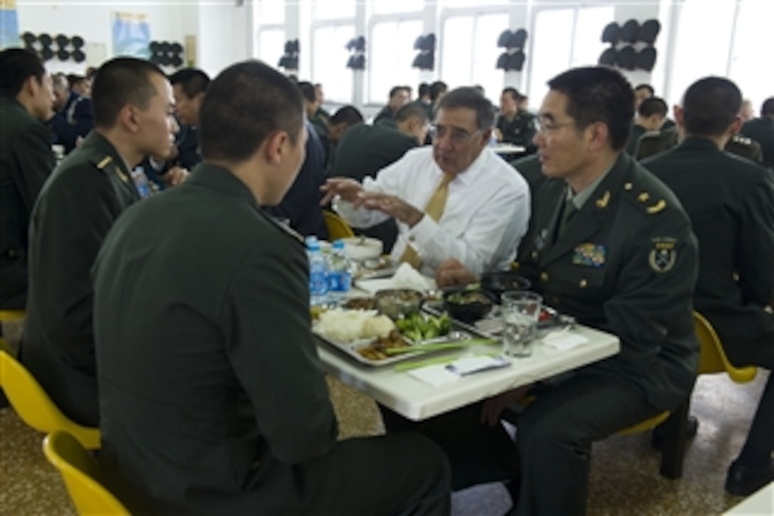 Secretary of Defense Leon E. Panetta has lunch with cadets from the People's Liberation Army Armored Forces Academy in Beijing, China, on Sept. 19, 2012.  Panetta also met with Chinese Vice President Xi Jinping and his defense counterparts to discuss regional security issues of interest to both nations.  Panetta visited Tokyo, Japan, before continuing to Beijing and will travel to Auckland, New Zealand, on a weeklong trip to the Pacific.  