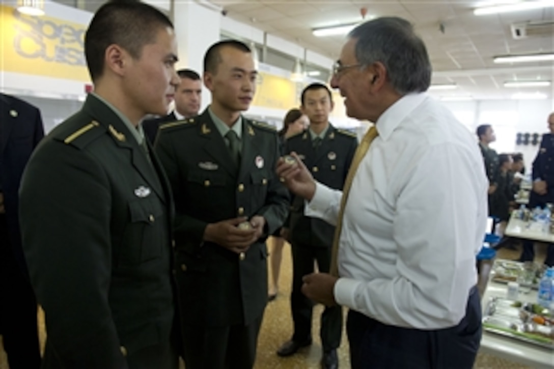Secretary of Defense Leon E. Panetta explains the American tradition of military challenge coins to cadets from the People's Liberation Army Armored Forces Academy in Beijing, China, on Sept. 19, 2012.  Panetta also met with Chinese Vice President Xi Jinping and his defense counterparts to discuss regional security issues of interest to both nations.  Panetta visited Tokyo, Japan, before continuing to Beijing and will travel to Auckland, New Zealand, on a weeklong trip to the Pacific.  