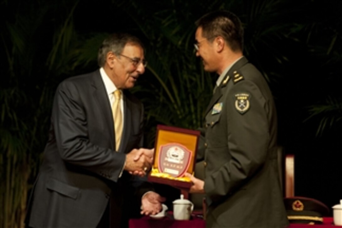 Commander of the People's Liberation Army Armored Forces Academy Maj. Gen. Zu Hang presents Secretary of Defense Leon E. Panetta with a plaque in Beijing, China, on Sept. 19, 2012.  Panetta also met with Chinese Vice President Xi Jinping and his defense counterparts to discuss regional security issues of interest to both nations.  Panetta visited Tokyo, Japan, before continuing to Beijing and will travel to Auckland, New Zealand, on a weeklong trip to the Pacific.  