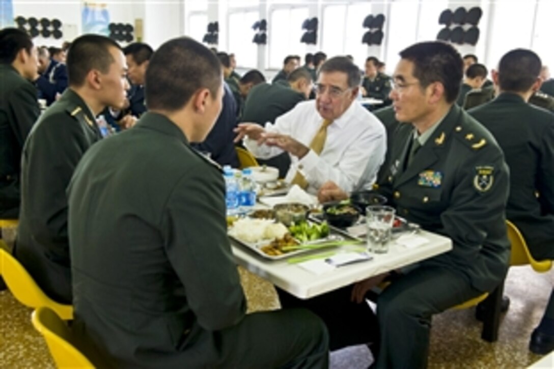 U.S. Defense Secretary Leon E. Panetta has lunch with cadets from the People's Liberation Army's armored forces engineering academy in Beijing, Sept. 19, 2012. Panetta visited Tokyo before Bejing, and will travel to Auckland, New Zealand, during a weeklong trip to the Asia-Pacific region.