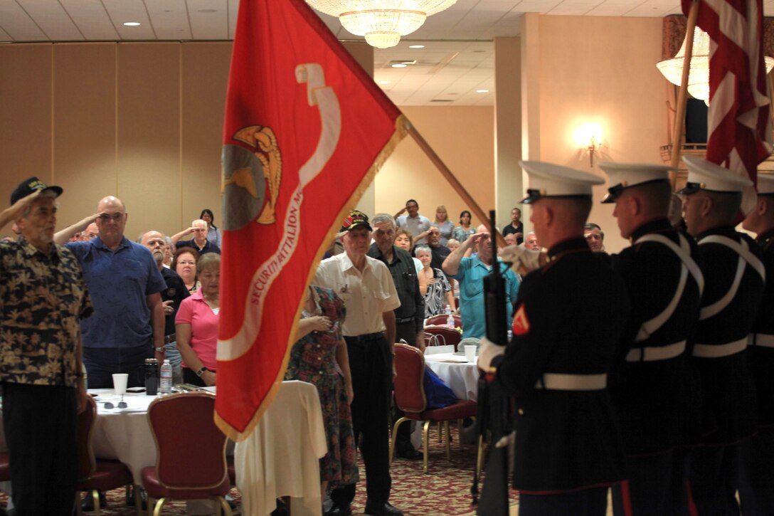 Retired military men and women salute colors as the National Anthem plays during the 19th Annual Retiree Expo at the Pacific Views Event Center, Sept. 15. The Expo allowed government agencies and the local military community to provide information on issues relative to retired military personnel.  