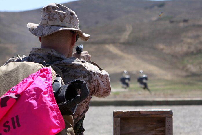 A competitor fires a .9 mm pistol during the range portion of the 4th Annual Recon Challenge on Marine Corps Base Camp Pendleton, Sept. 15. Time was deducted or added to the teams’ end finish times depending on how accurate the shot during both the pistol range and the rifle range.