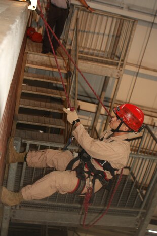 Randall’s Island, NEW YORK –Sergeant Daniel Barbadillo, an extraction Marine with Initial Response Force “B,”  prepares to repel down two stories to rescue a “stranded victim” from a ledge and get them safely to the ground. The FDNY has been involved in training the Mariens and sailors of CBIRF since 1997, when Chief Raymond Downey helped expand CBIRF’s technical rescue platform.