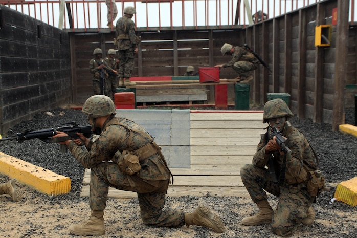 Recruits of Co. D, 1st Recruit Training Battalion, post security while fellow recruits work to finish a Twelve Stalls mission aboard Marine Corps Base Camp Pendleton, Sept. 11. If at any time security wasn’t posted during an exercise recruits were given an additional physical exercise.