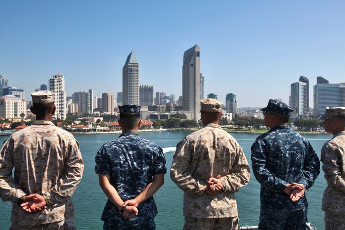 Marines and sailors with the 15th Marine Expeditionary Unit and USS Peleliu man the rails of the USS Peleliu Sept. 17.  The MEU embarked the ships of the Peleliu Amphibious Ready Group and pulled away from the pier at Naval Base San Diego for its deployment to the Western Pacific.