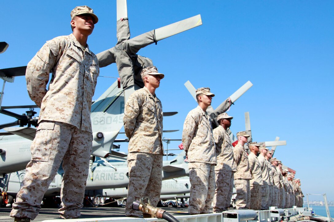 Marines with the 15th Marine Expeditionary Unit man the rails of the USS Peleliu Sept. 17.  The MEU embarked the ships of the Peleliu Amphibious Ready Group and pulled away from the pier at Naval Base San Diego for its deployment to the Western Pacific.