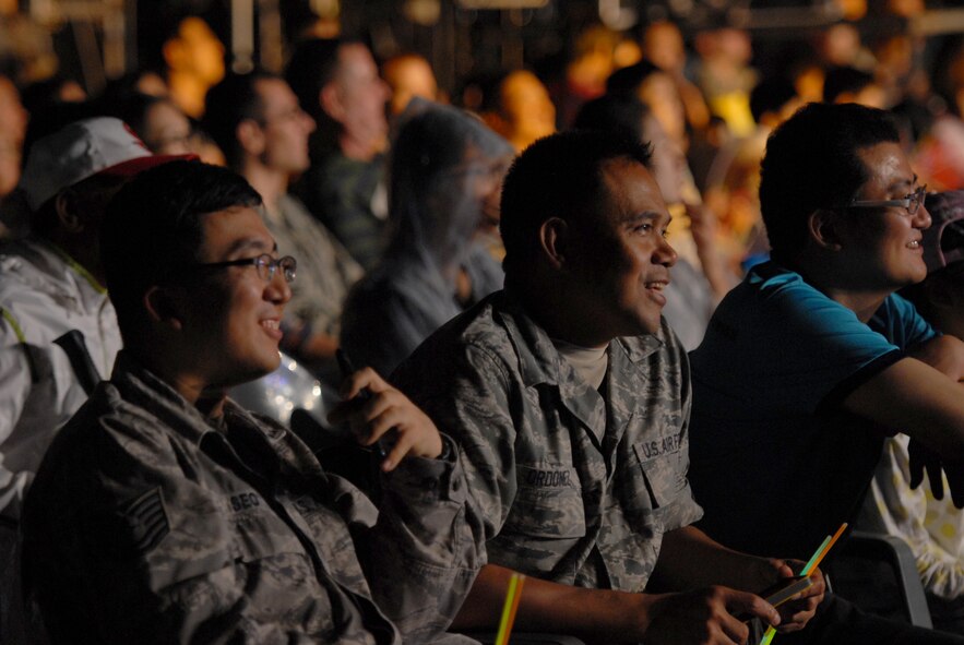 United States Air Force Airmen, Republic of Korea Air Force and civilian personnel enjoy a Korean Pop concert on Kunsan Air Base, Rok., Sept. 13, 2012. More than a thousand people gathered to watch Rain, Stella, Kaymon, Sunny Hill and Sunny Day perform.  (U.S. Air Force photo/ Staff Sgt. Tong Duong)