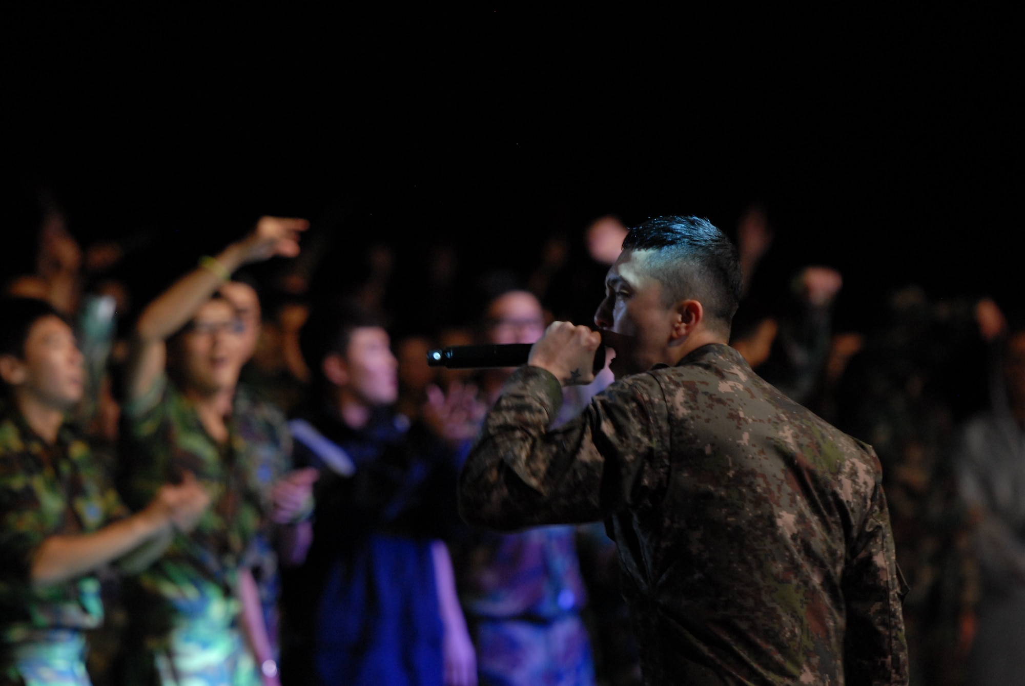 DiAction, a Korean rapper of the group Untouchables, entertains Republic of Korea Air Force, United States Air Force and civilian personnel on Kunsan Air Base, Rok., Sept. 13, 2012. The Armed Forces Tour was a salute to troops at Kunsan and other military bases throughout South Korea. (U.S. Air Force photo/ Staff Sgt. Tong Duong)