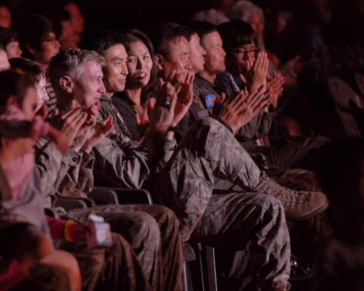 U.S. Air Force Col. John Pearse, 8th Fighter Wing commander, and Republic of Korea Air Force Col. Eun-Sung Baek, 38th Fighter Group commander, enjoy an Armed Forces Tour concert on Kunsan Air Base, RoK., Sept. 13, 2012. More than a thousand people gathered to watch Korean Pop singers such as Rain, Stella, Kaymon, Sunny Hill and Sunny Day.  (U.S. Air Force photo/ Staff Sgt. Tong Duong)