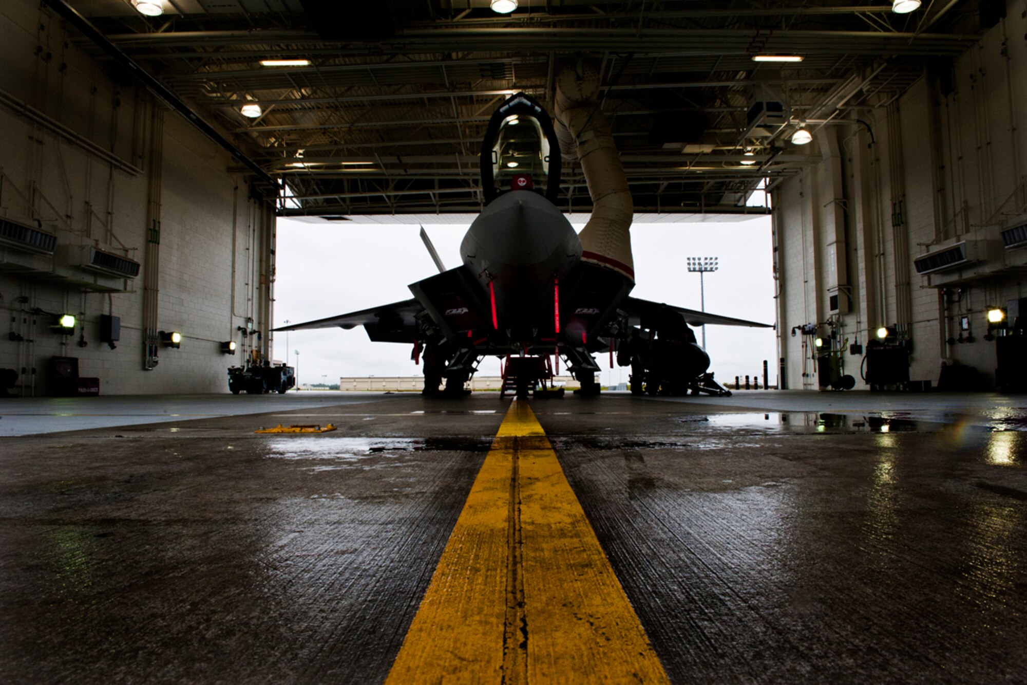 JOINT BASE ELMENDORF-RICHARDSON, Alaska -- The Airmen from the 90th Fighter Squadron and Air Craft Maintenence Unit prepare an F-22 for combat in a 90th FS hanger, August 20,2012. The F-22 was perepared as if it were actually going into combat. (U.S. Air Force Photo/ Airman 1st Class Omari Bernard)