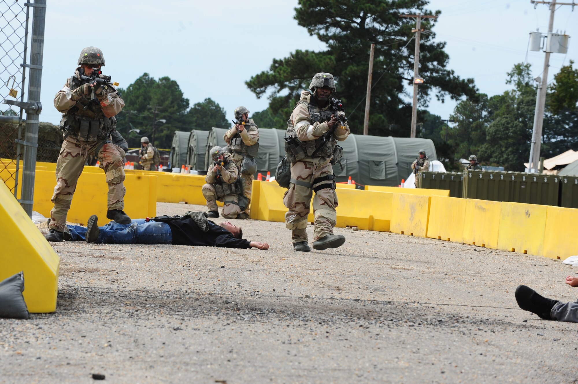 U.S. Air Force Airmen assigned to the 4th Security Forces Squadron carry a moulage patient on a litter after a simulated attack during Operational Readiness Exercise Coronet Warrior 12-04 at Base X on Seymour Johnson Air Force Base, N.C., Sept. 20, 2012. Airmen are trained to administer self-aid buddy care in order to assist the injured until medical technicians are available to take over. (U.S. Air Force photo/Airman 1st Class Aubrey Robinson/Released)