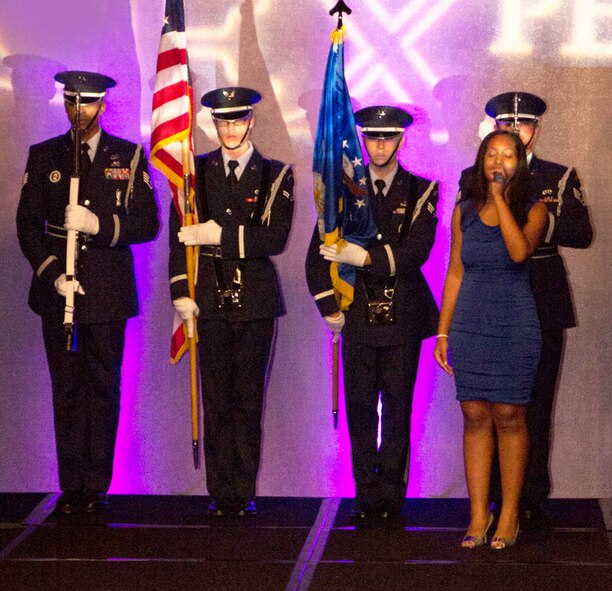 The 94th Airlift Wing Honor Guard presents the colors as Mryna Dabel sings the National Anthem during a fashion gala benefitting the American Homeless Veterans Foundation at the W Hotel midtown, Atlanta, Ga. Sept. 2. The foundation, a non-profit organization, strives to eradicate veteran homelessness in our nation. (photo by Damon Peebles)