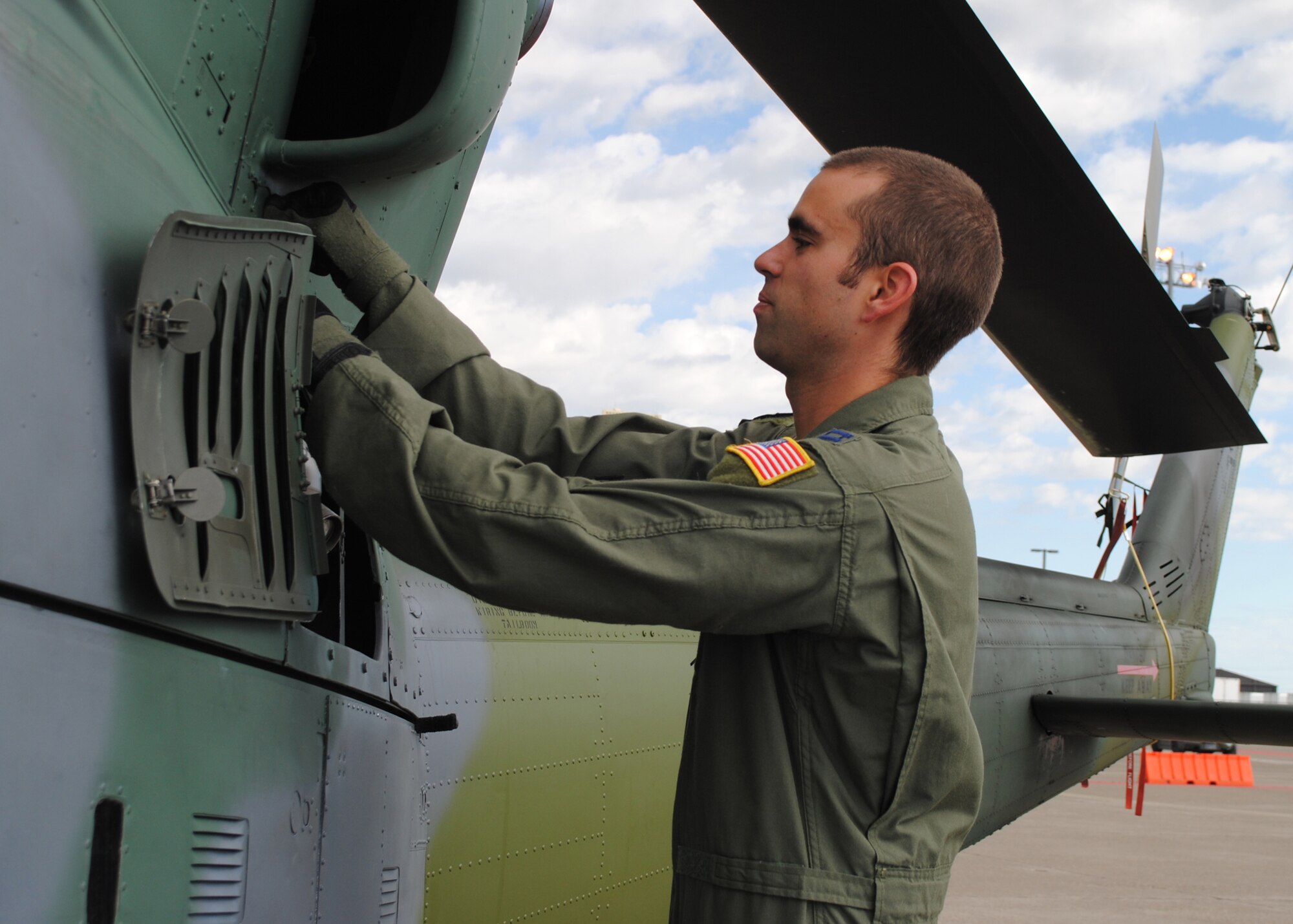 Capt. Stephen Struber, 40th HS tactics officer and UH-1N pilot, performs a routine preflight inspection on a UH-1N Huey helicopter. Struber was one of three 40th HS members chosen to represent Malmstrom at the 2012 Global Strike Challenge. (U.S. Air Force photo/Airman 1st Class Katrina Heikkinen)
