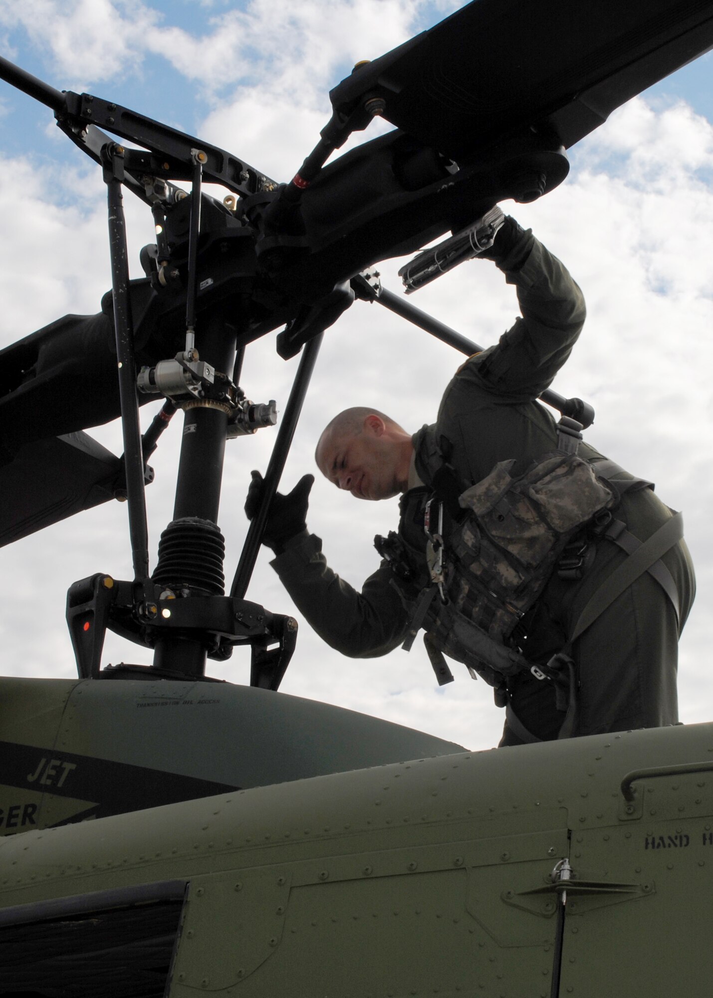 Tech. Sgt. David Galasso, 40th Helicopter Squadron UH-1N flight engineer, checks the functionality of a helicopter’s propeller. Galasso is the flight engineer of the three-man aircrew chosen to represent the 40th HS in the 2012 Global Strike Challenge at Camp Guernsey, Wyo., Oct. 3 to 6. (U.S. Air Force photo/Airman 1st Class Katrina Heikkinen)