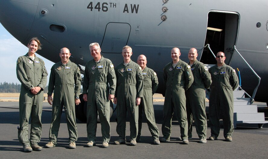 Delivering P-218, the newest C-17 to serve at McChord Field, Wash., was the crew of Lt. Cols.  Laura Theodoron and Christopher VonThanden, Col. Bruce Bowers, Lt. Col. Anthony Angello, Chief Master Sgt. James Caron, Tech. Sgt. Andrew Thatcher, Capt. Patrick Hancock, and Tech. Sgt. Michael Chop.  Colonel Bowers dropped off the "keys" to the aircraft Sept. 14. The 446th AW is an Air Force Reserve wing here, sharing global airlift missions with the 62nd AW, the aircraft-owning unit. With three C-17 flying squadrons, the 2,300-strong wing provides aircrews and support on a daily basis to execute the Air Force's global airlift mission. (U.S. Air Force photo by Sandra Pishner) 