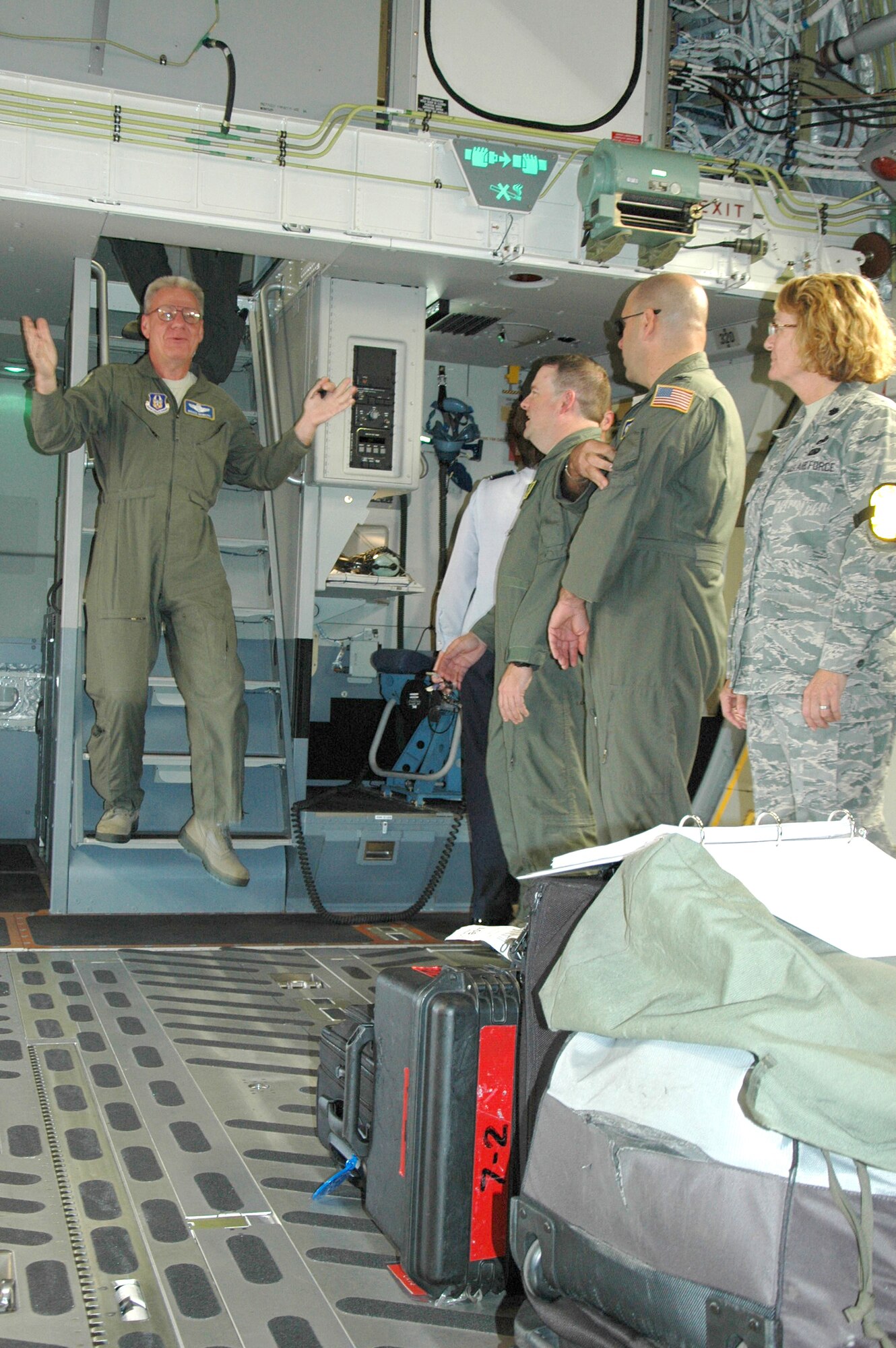 Col. Bruce Bowers, 446th Airlift Wing commander, presents P-218, the newest C-17, to active and Reserve Airmen at McChord Field, Wash. The 446th AW is an Air Force Reserve wing here, sharing global airlift missions with the 62nd AW, the aircraft-owning unit. With three C-17 flying squadrons, the 2,300-strong wing provides aircrews and support on a daily basis to execute the Air Force's global airlift mission. (U.S. Air Force photo by Sandra Pishner)