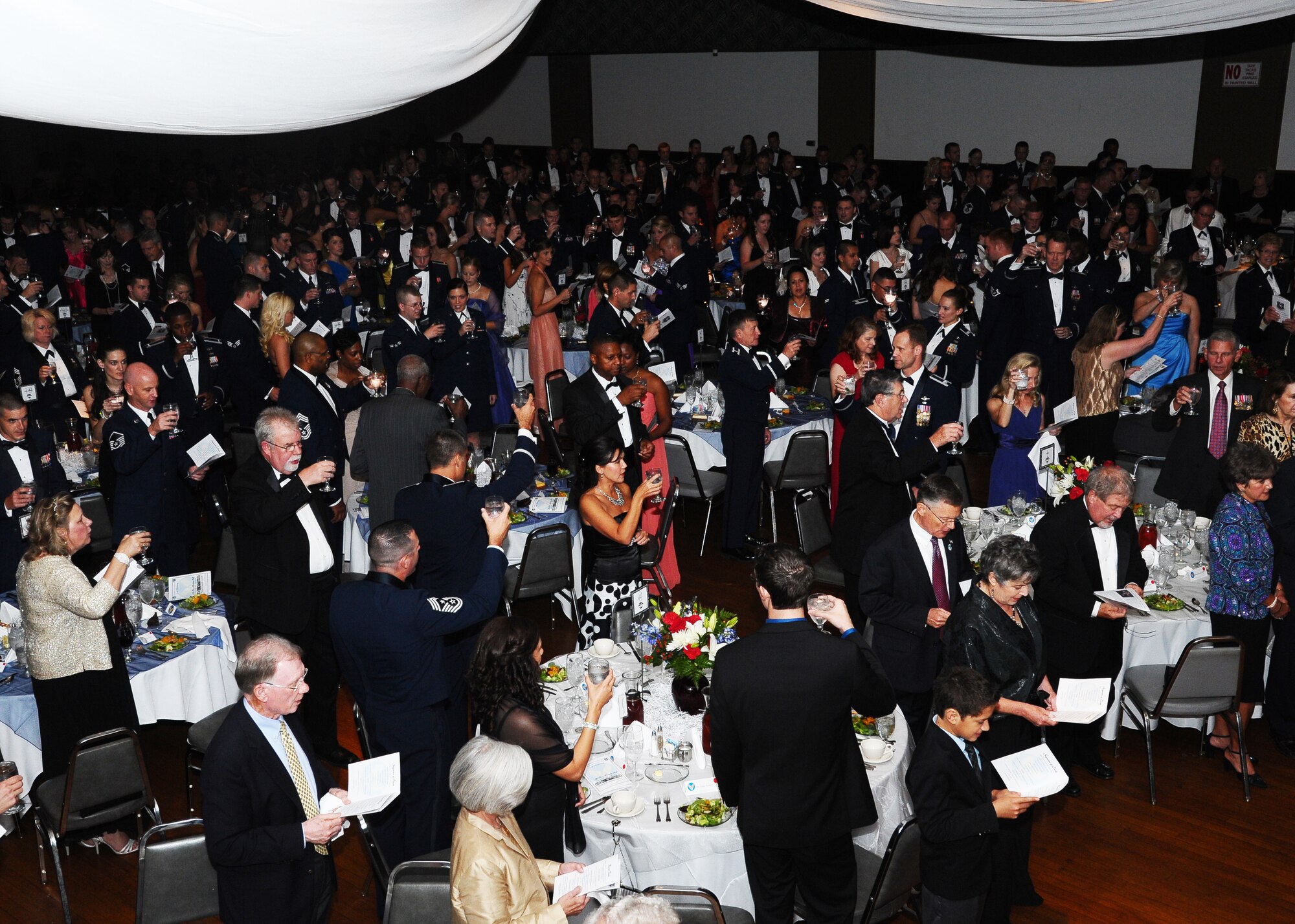 The audience of the 2012 Air Force Birthday Ball raises their glasses during the toasts led by the Columbus Air Force Base Group Commanders and the guest speaker.  The toasts honor Air Force senior leadership, the president and the men and women fighting for their country.  (U.S. Air Force Photo/Airman 1st Class Charles Dickens)