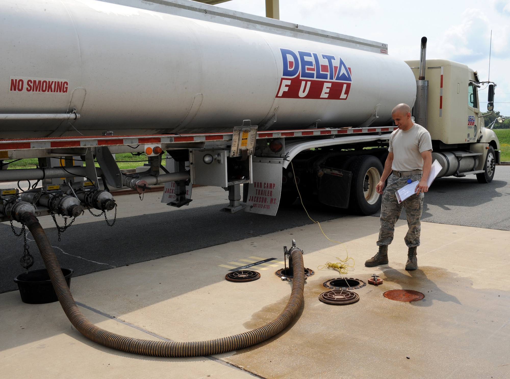 Senior Airman Derek McLemore, 2nd Logistics Readiness Squadron facilities maintainer, ensures biodiesel is being properly distributed into a fuel station on Barksdale Air Force Base, La., Sept. 18. McLemore goes through a checklist of tasks that need to be done while fuel is being distributed into the base. (U.S. Air Force photo/Airman 1st Class Benjamin Gonsier)(RELEASED)

