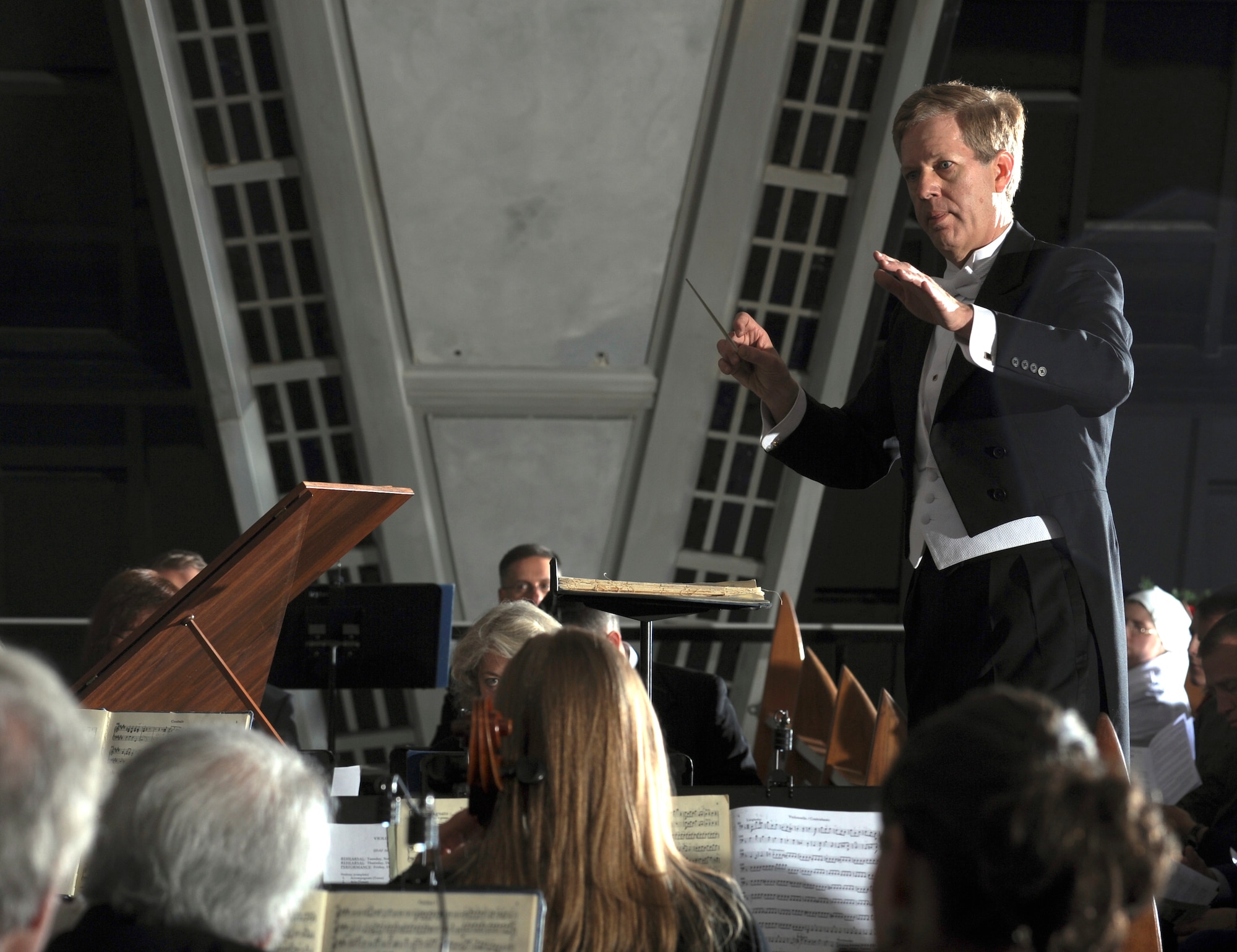 Dr. Joe Galema conducts the Cadet Chorale and Colorado Springs Philharmonic's performance of Handel's "Messiah" in the Air Force Academy Cadet Chapel Dec. 2, 2011. Galema, the Cadet Chapel's music director and organist, started working at the Academy in September 1982. (U.S. Air Force photo/Don Branum)
