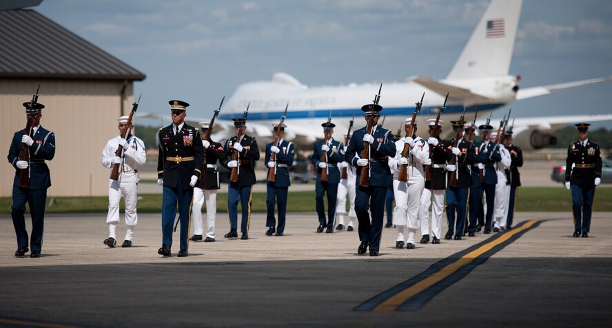 A Joint Forces Honor Guard marches during the dignified transfer of remains for J. Christopher Stevens, U.S. ambassador to Libya, and three other Americans on Sept. 14, 2012, at Joint Base Andrews, Md. The U.S. State Department held a ceremony on base to honor the Americans who gave their lives in service to their country. (U.S. Air Force photo/Senior Airman Perry Aston)