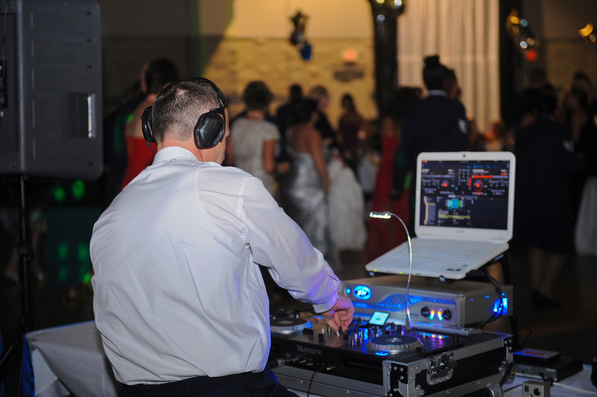 U.S. Air Force Staff Sgt. Jamie Allen, 476th Maintenance Squadron crew chief, mixes music on an audio mixer during the Air Force Ball in Valdosta, Ga., Sept. 14, 2012. The ball celebrated the Air Force’s 65th year as a separate service and recognized the Airmen who served throughout its history. (U.S Air Force photo by Airman 1st Class Olivia Dominique/Released) 