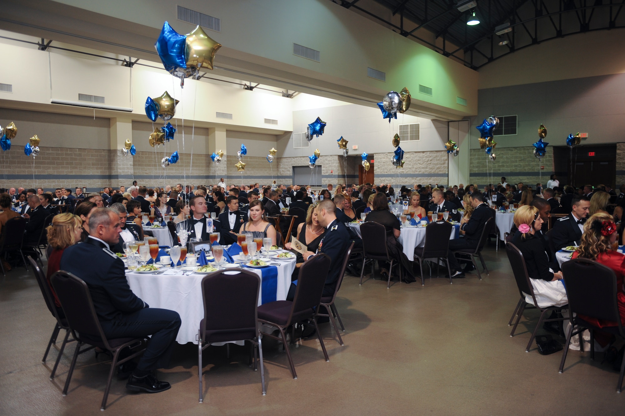 Airmen and guests prepare for dinner during the Air Force Ball in Valdosta, Ga., Sept. 14, 2012. Approximately 400 guests attended to celebrate the Air Force’s 65th birthday. (U.S Air Force Olivia Dominique/Released) 