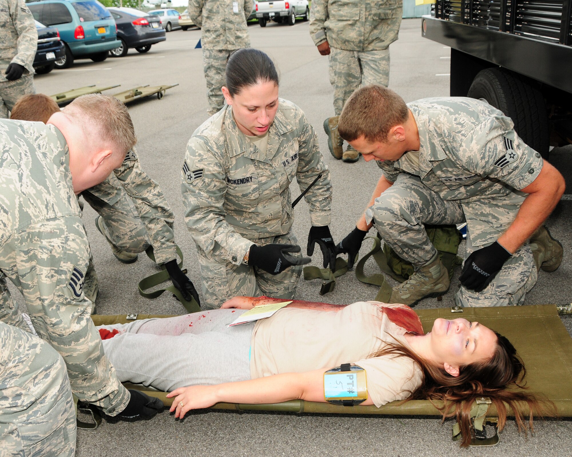 914th Aero Patient Staging Squadron members prepare a patient for transfer on a litter (stretcher) during a recent mass causality exercise at the Niagara Falls Air Reserve Station, NY on September 9, 2012. The exercise was conducted to test the medical readiness and skills of the unit during an emergency. This exercise is an annual requirement for the ASTS. (US Air Force photo by Peter Borys)