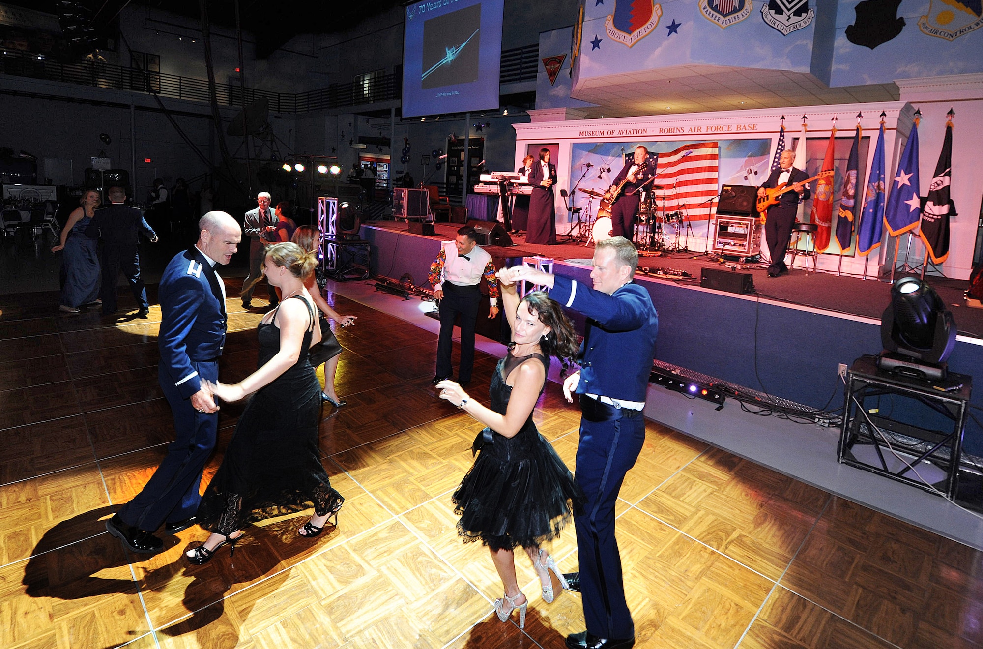 Attendees dance the night away Saturday during the Air Force Birthday 65th Birthday celebration at the Museum of Aviation. Keynote speaker was Lt. Gen. Andrew Busch, Air Force Materiel Command vice commander. The Band of the U.S. Air Force Reserve also performed.  (U.S. Air Force photo/ Tommie Horton)