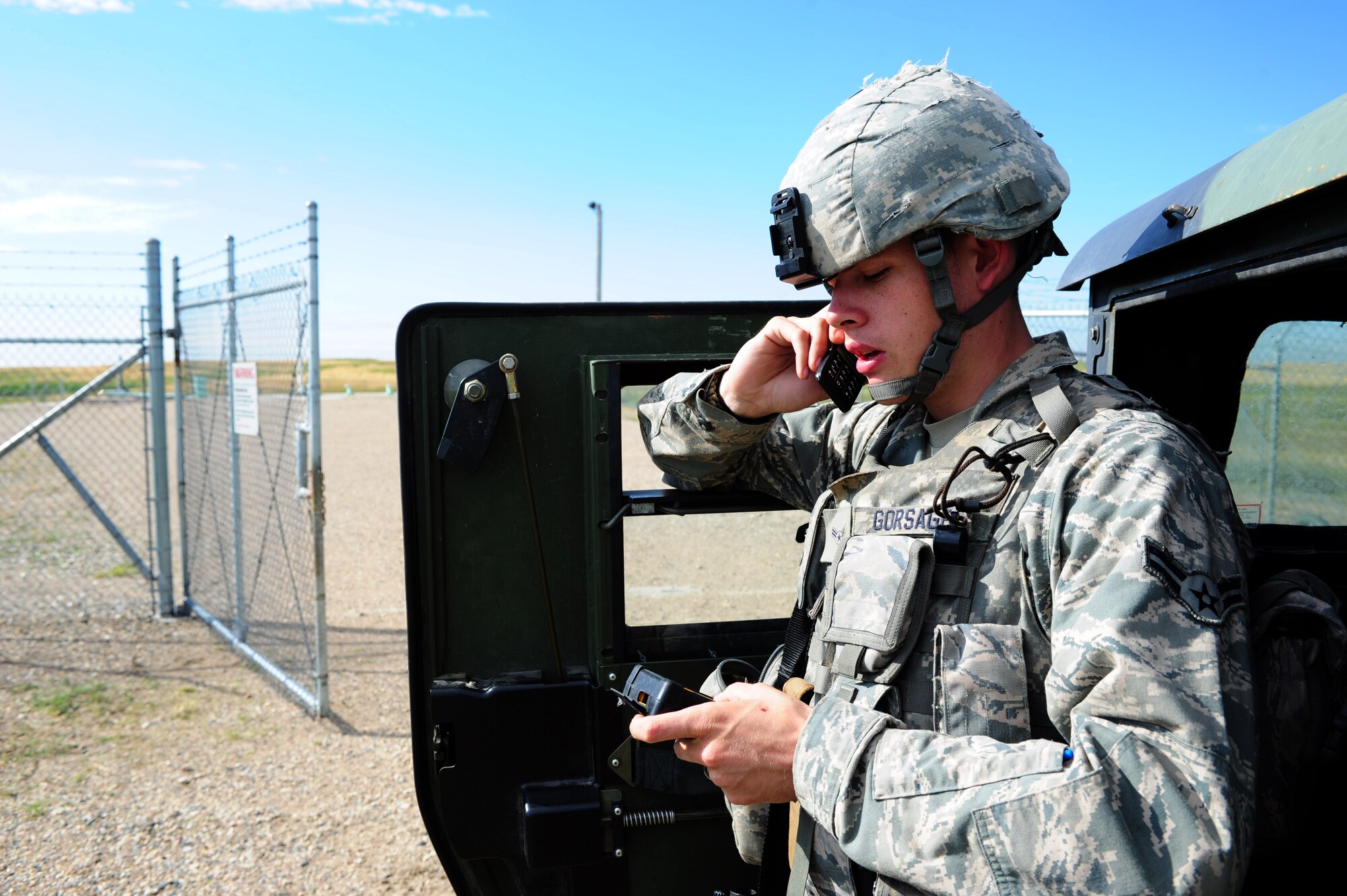 MINOT MISSILE COMPLEX, N.D. -- Airman 1st Class Devin Gorsage (now Senior Airman), 91st Missile Security Forces Squadron response force leader, calls the flight security controller to notify the status of a launch facility. Members of the 91st MSFS provide constant security to national assets located in the missile complex. (U.S. Air Force photo/Senior Airman Michael J. Veloz)